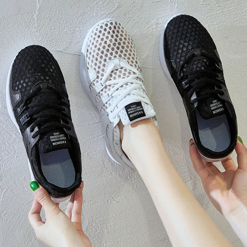 Breathable hollow-out mesh sneakers in black on a white background.