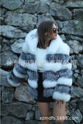 Loose fit women's hooded coat in artificial fur, shown in brown colour, street fashion style.