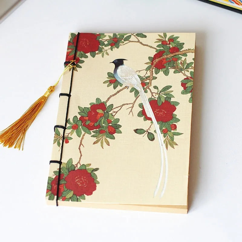 A5 antique thread-bound notebook with embossed cover and decorative tassels