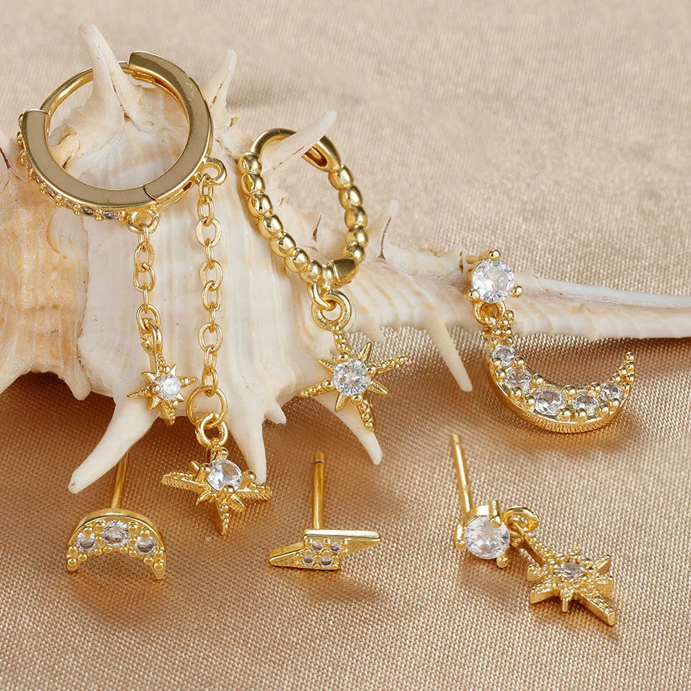 Six gold-colour chain tassel earrings with zircon detail arranged as a complete set