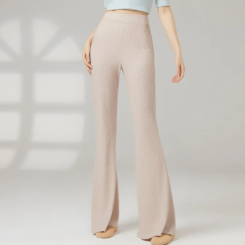 Women's solid colour dance practice pants in stretch polyester fabric on a hanger.