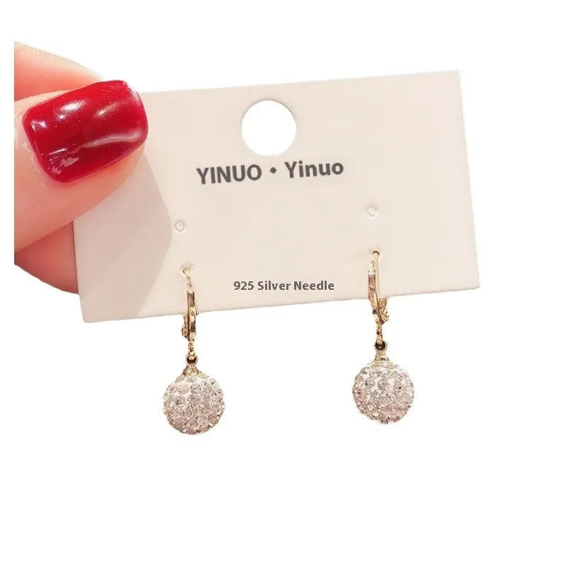 Geometric copper earrings with rose design elements and zircon detail in silver electroplated finish