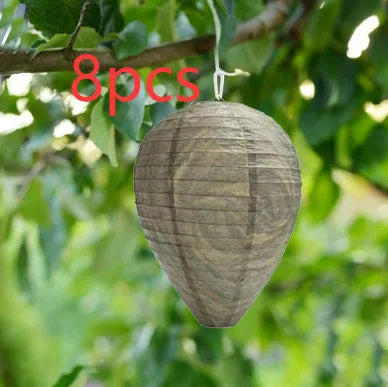 A rectangular photo colour beehive lantern with a honeycomb paper structure and wire frame.