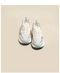 Women's grey and pink retro sneaker with low-top design and rubber sole