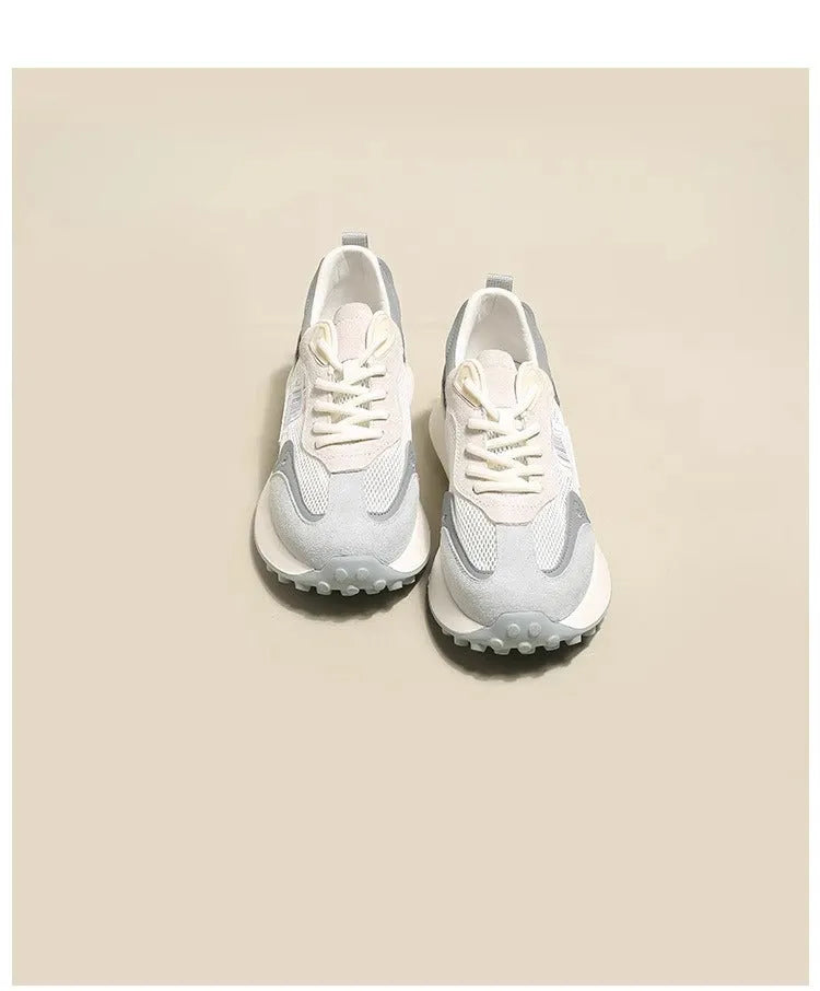 Women's grey and pink retro sneaker with low-top design and rubber sole
