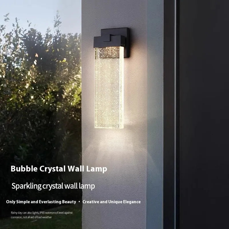 Black outdoor LED wall lamp in stainless steel with warm light for courtyards and corridors