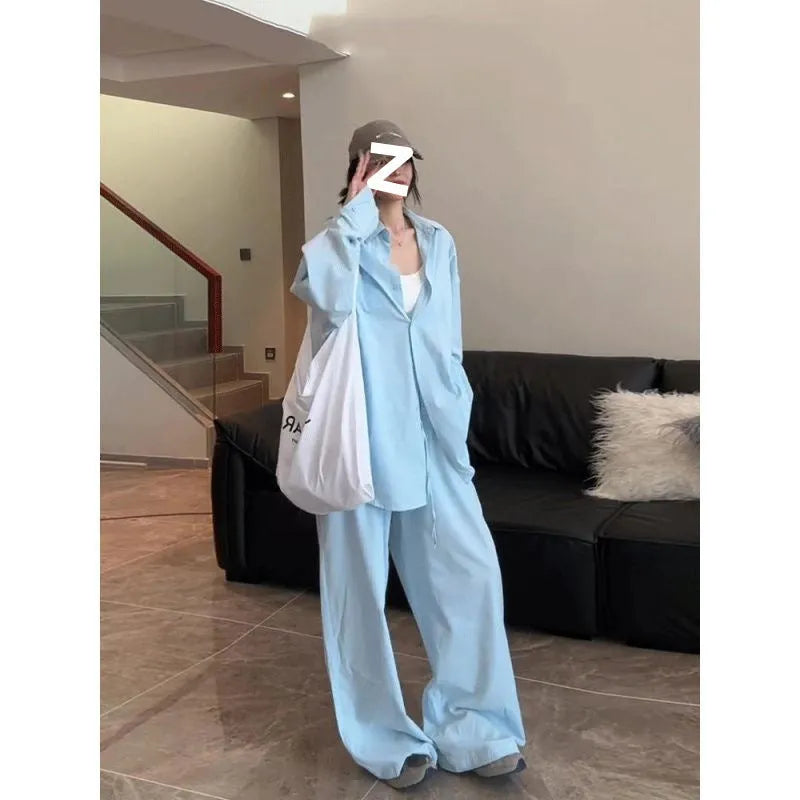 Women's blue shirt and wide-leg pants suit with flight sleeve and button stitching details