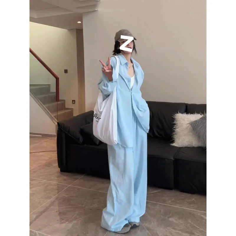 Women's blue shirt and wide-leg pants suit with flight sleeve and button stitching details