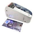 V31 foreign currency counting machine with purple light detector and LED display on a desk