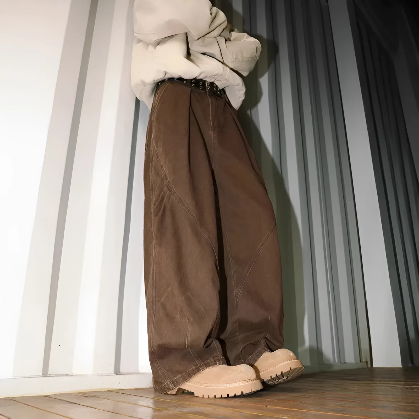 Men's straight-cut cotton trousers in black, brown, and apricot colours with striped pattern and pleated detailing