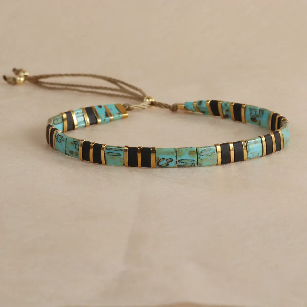 Geometric glass bead bracelet with pull adjustment in five colour options