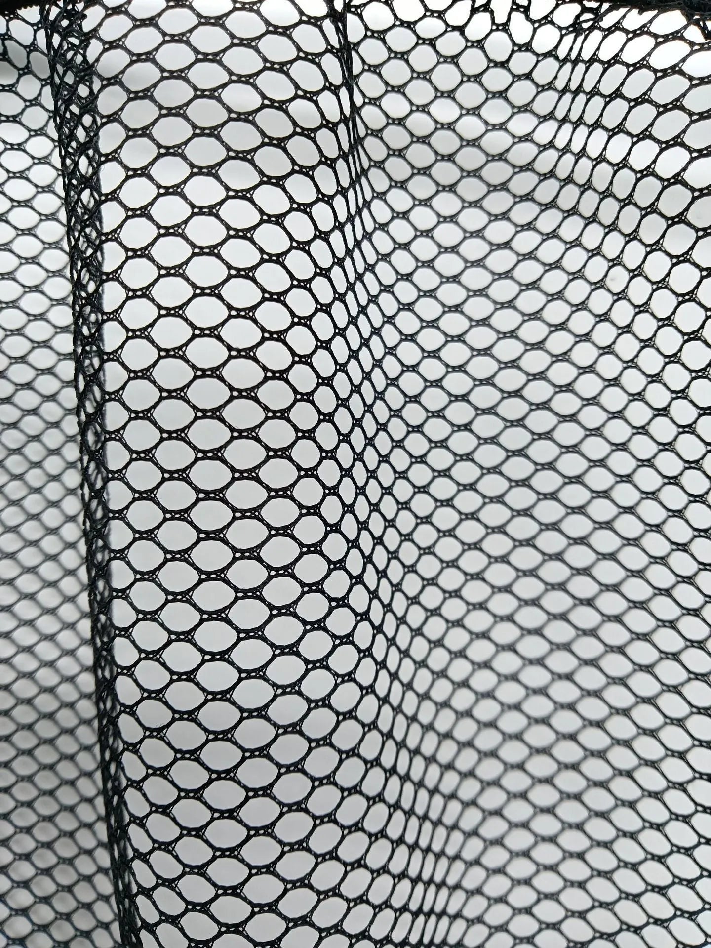 Car trunk elastic storage net in polyester material showing two size options for vehicle organisation