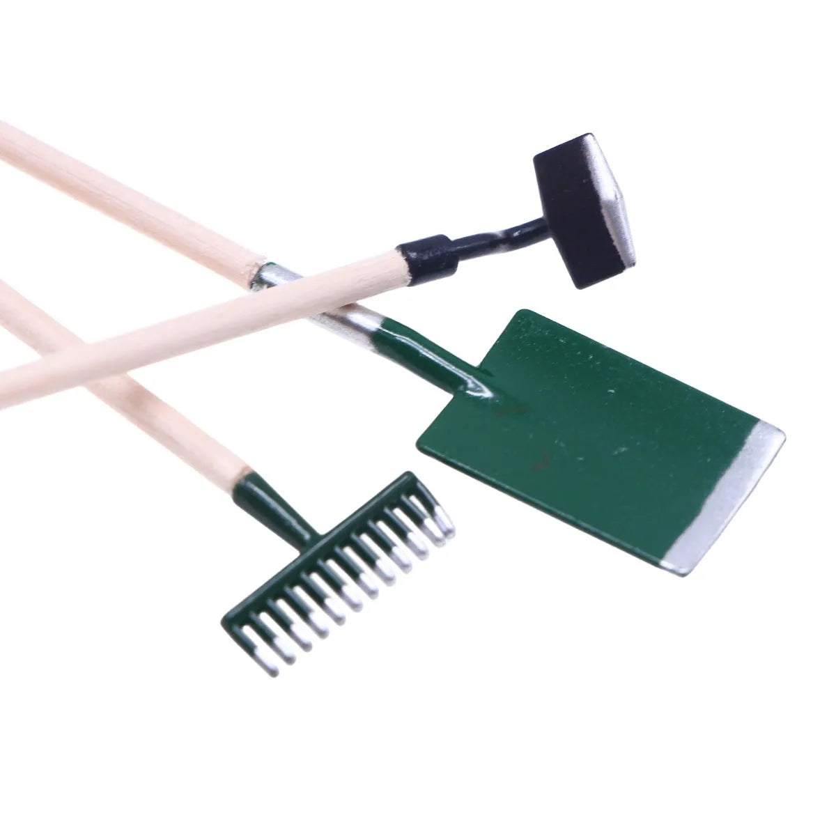 Three miniature alloy gardening tools set for dollhouse or elf garden scenes on white background