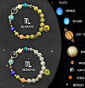 Set of two natural stone beaded bracelets for zodiac signs on a plain background