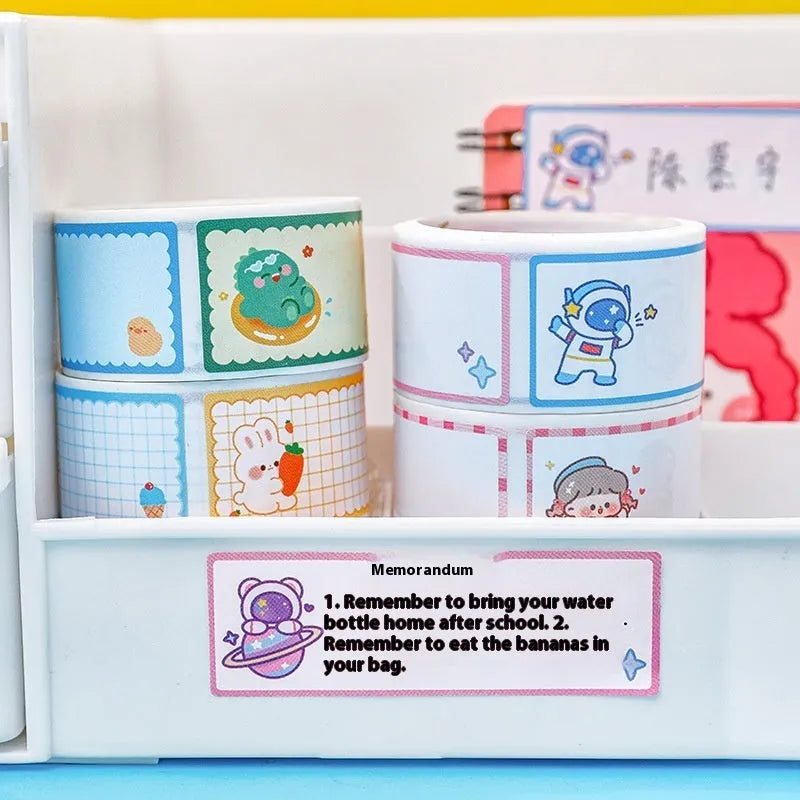 Roll of 60 cartoon name tape stickers showing dinosaur, astronaut, rabbit, and girl design options