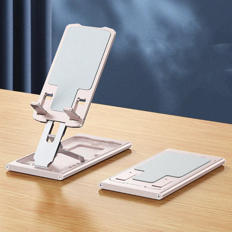 Foldable aluminum alloy phone holder in space gray on a desk holding an iPhone