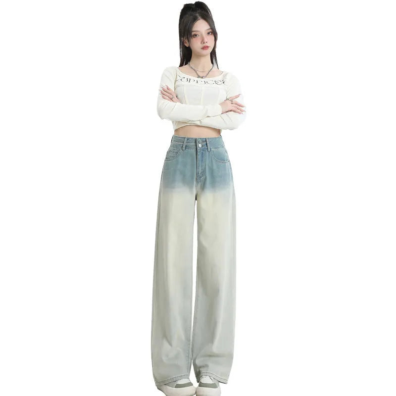 Women's gradient blue cotton denim wide-leg straight trousers on a hanger.