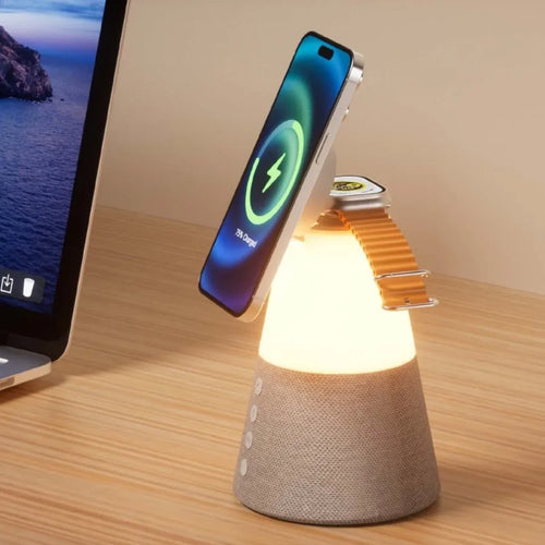 Grey 3-in-1 magnetic wireless charging Bluetooth speaker night light on a tabletop