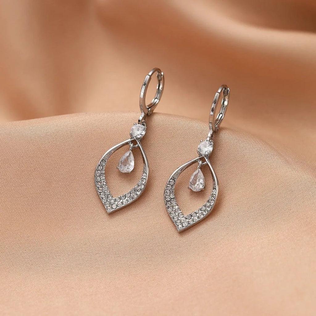 Women's gold or silver coloured zircon water drop earrings with a dangling tassel.