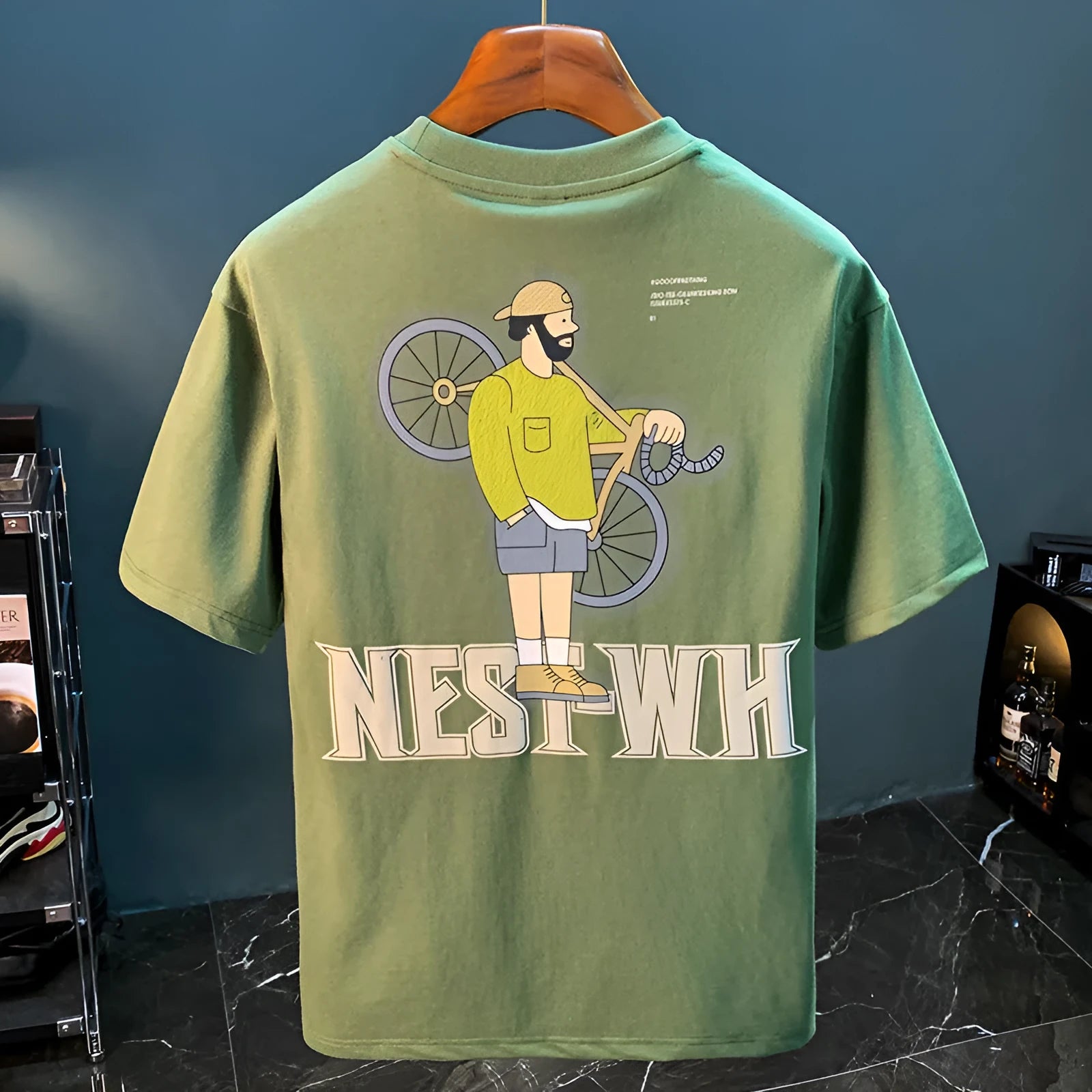 Green men's printed loose fit t-shirt with short sleeves shown on Asian sizing chart