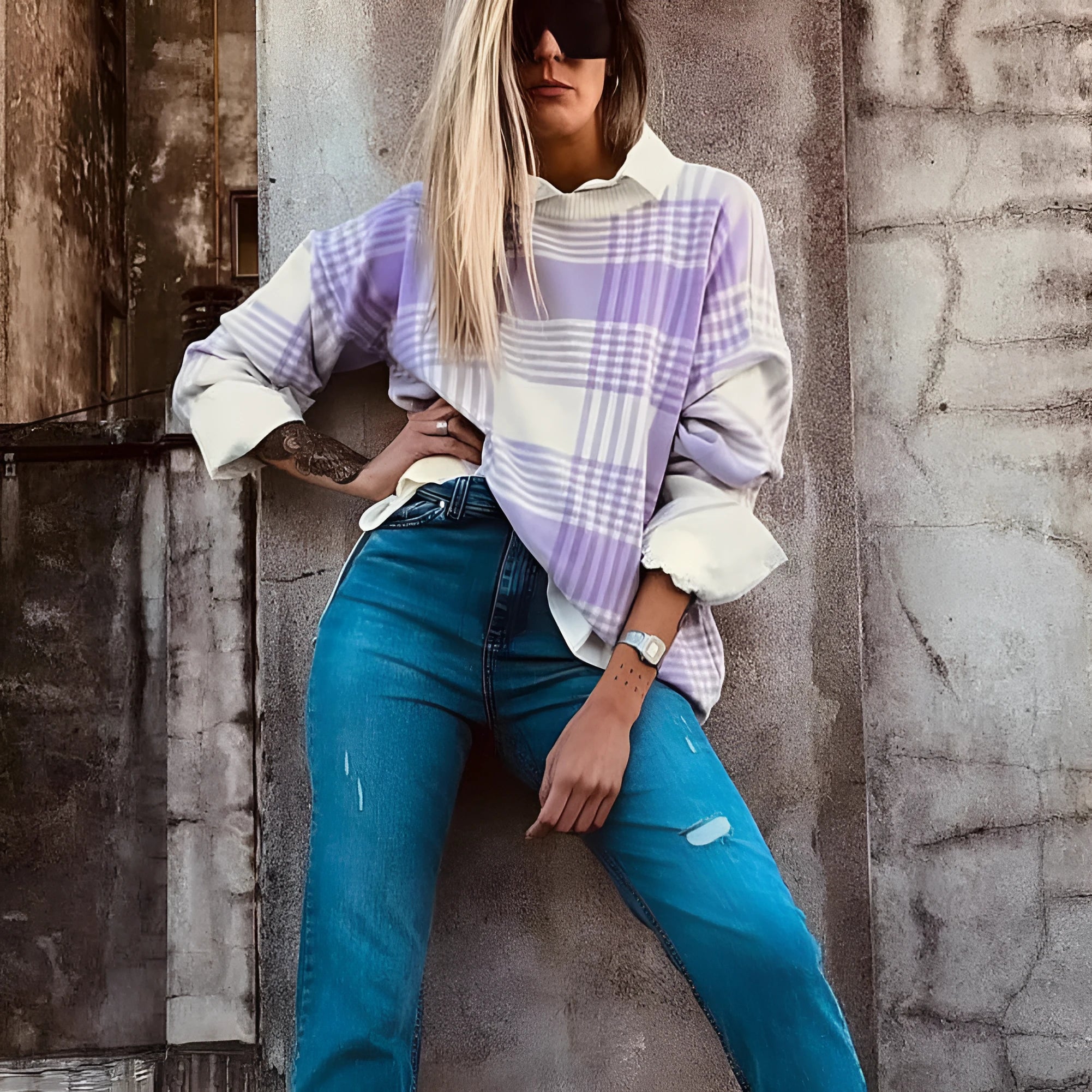 Loose fit long sleeve sweater in lilac plaid print with ribbed cuffs and hem.