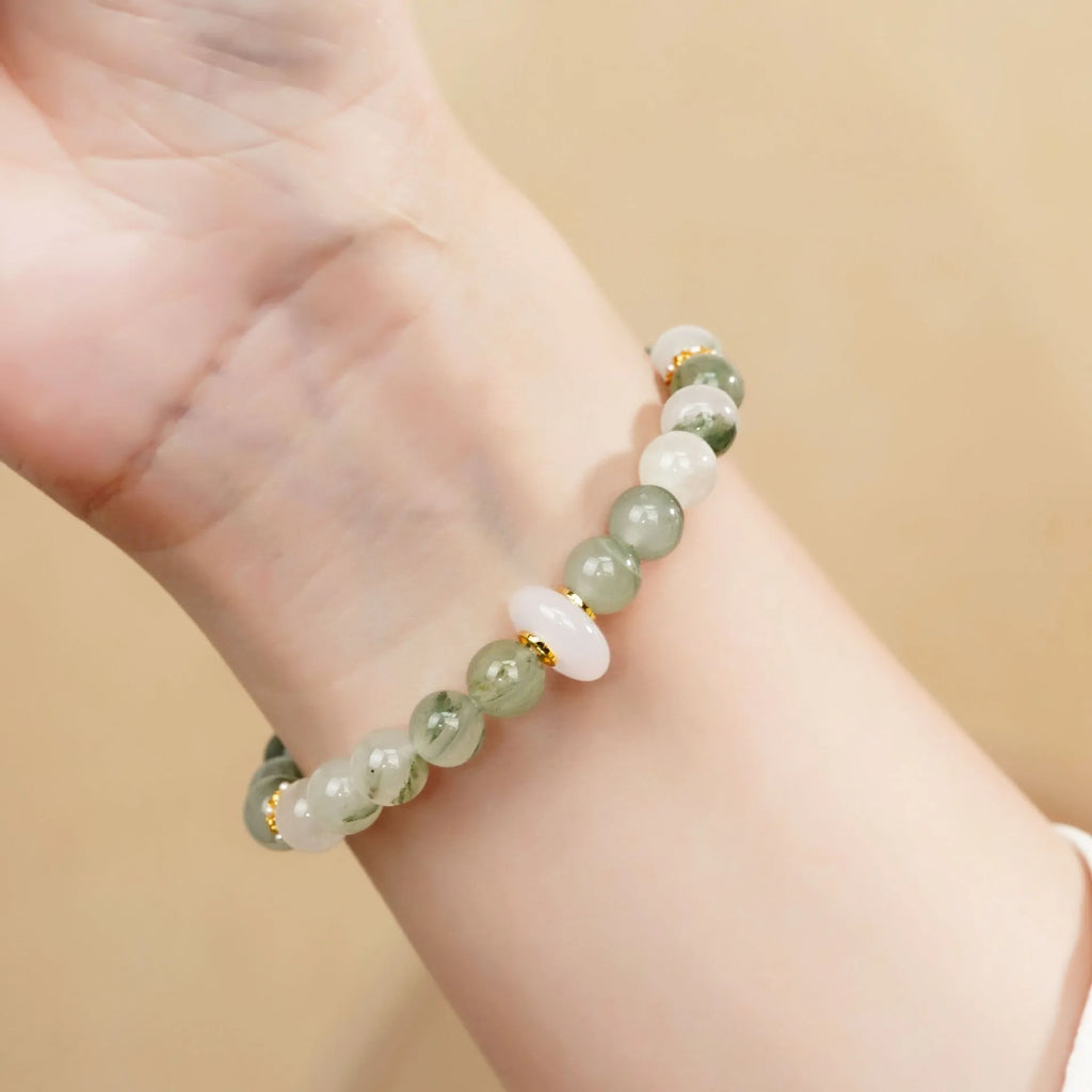 Emerald green jade bangle bracelet with floating flower design and round beads
