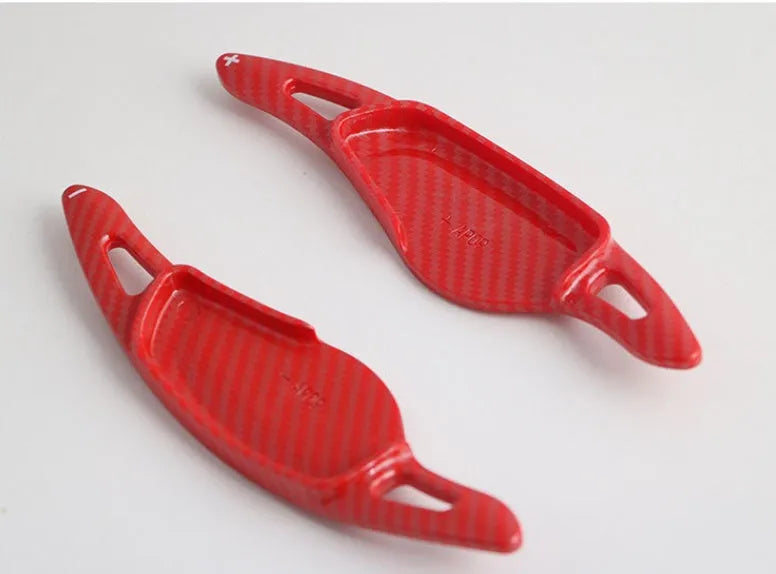 Carbon fibre pattern steering wheel paddle shift modification kit for car interior.