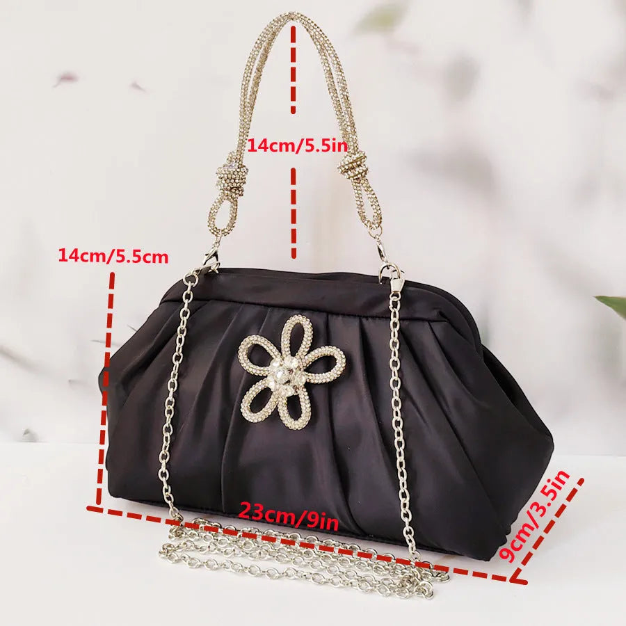 Women's soft shell-shaped polyester messenger bag in black with decorative chain and diamond details