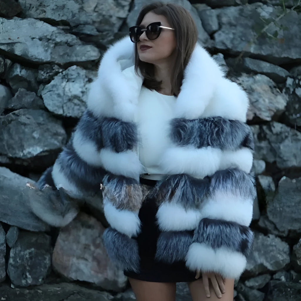 Loose fit women's hooded coat in artificial fur, shown in brown colour, street fashion style.