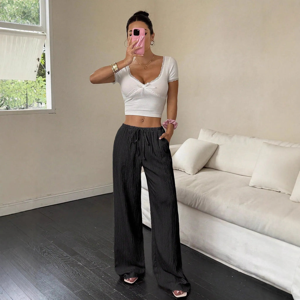 Women's wide leg trousers with lace-up waist trimming detail in polyester fabric