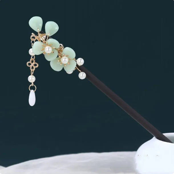 Chinese ancient style floral alloy hairpin with electroplated finish on dark background