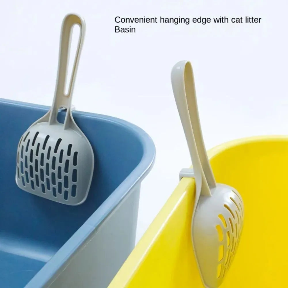 Grey plastic cat litter scoop sitting in its matching storage base