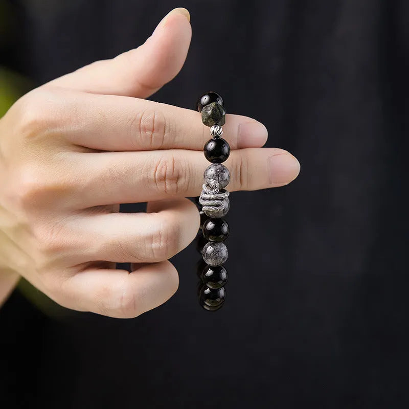 Black S925 sterling silver bracelet with snake modelling and obsidian stone details