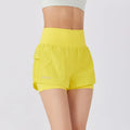 Women's loose casual quick-drying sports shorts in a cotton blend fabric on a hanger.