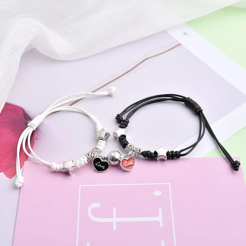 Alloy magnetic suction bracelet pair for couples with symbolic design options