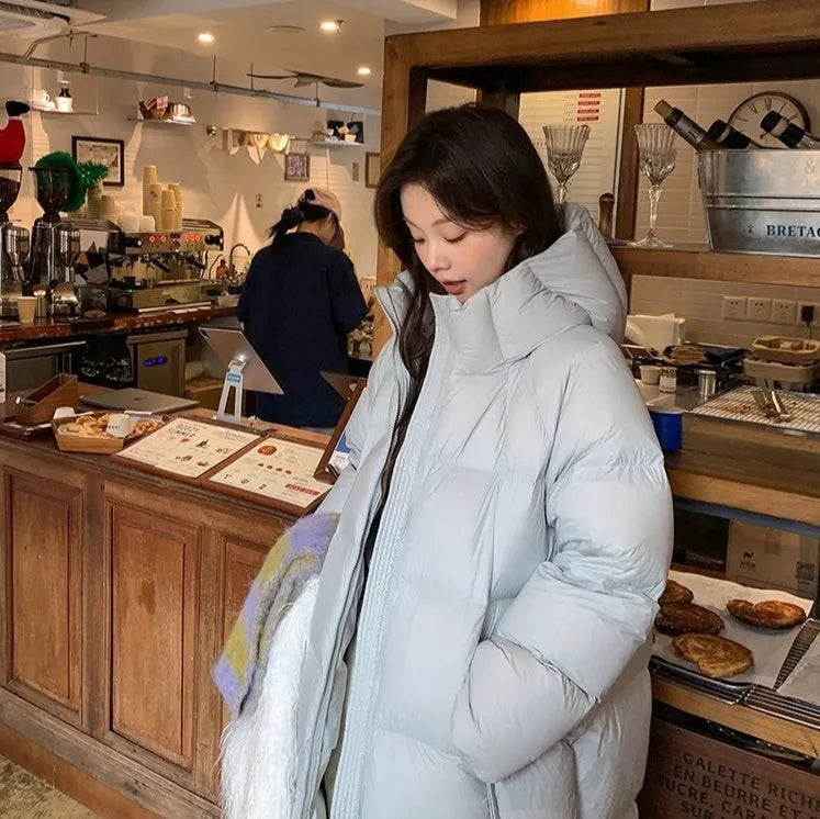 Women's mid-length loose padded puffer coat in beige with white duck down filler and pocket