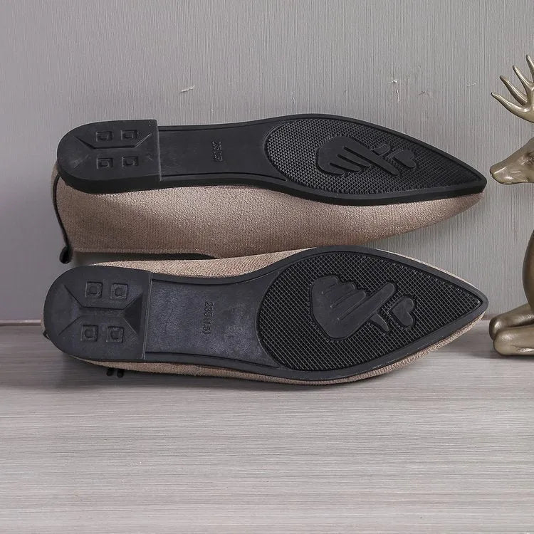Beige leopard print women's pointed toe pumps on a white background, side view.