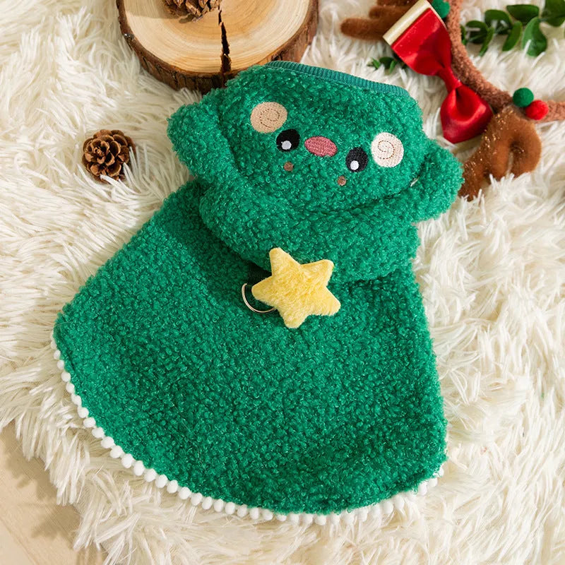 Green granular velvet cat cape with Christmas tree hat and star, lying on a white background