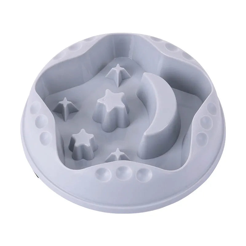 Large blue slow feeder dog bowl with raised moon and star wing patterns and a non-slip rubber base.