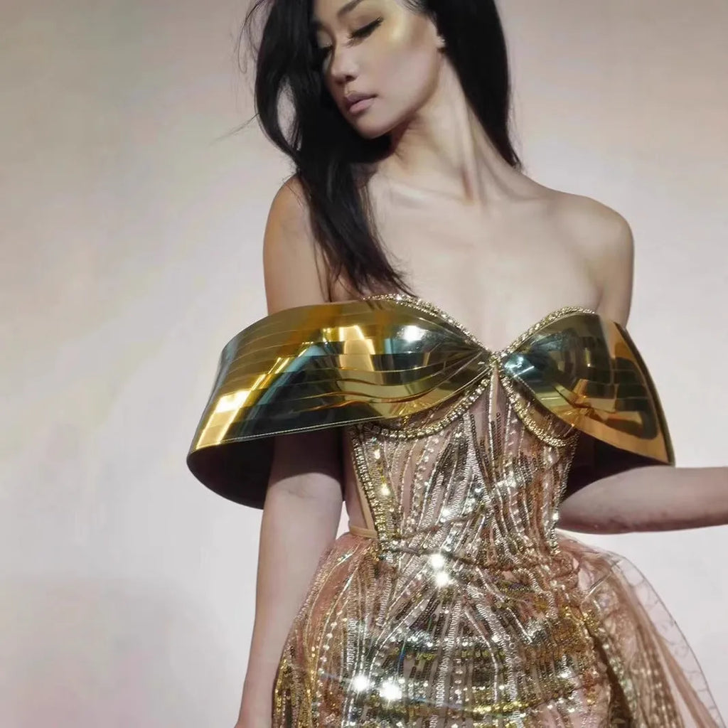 Gold strapless sequined dress with thigh-high split and tulle overlay, formal women's gown