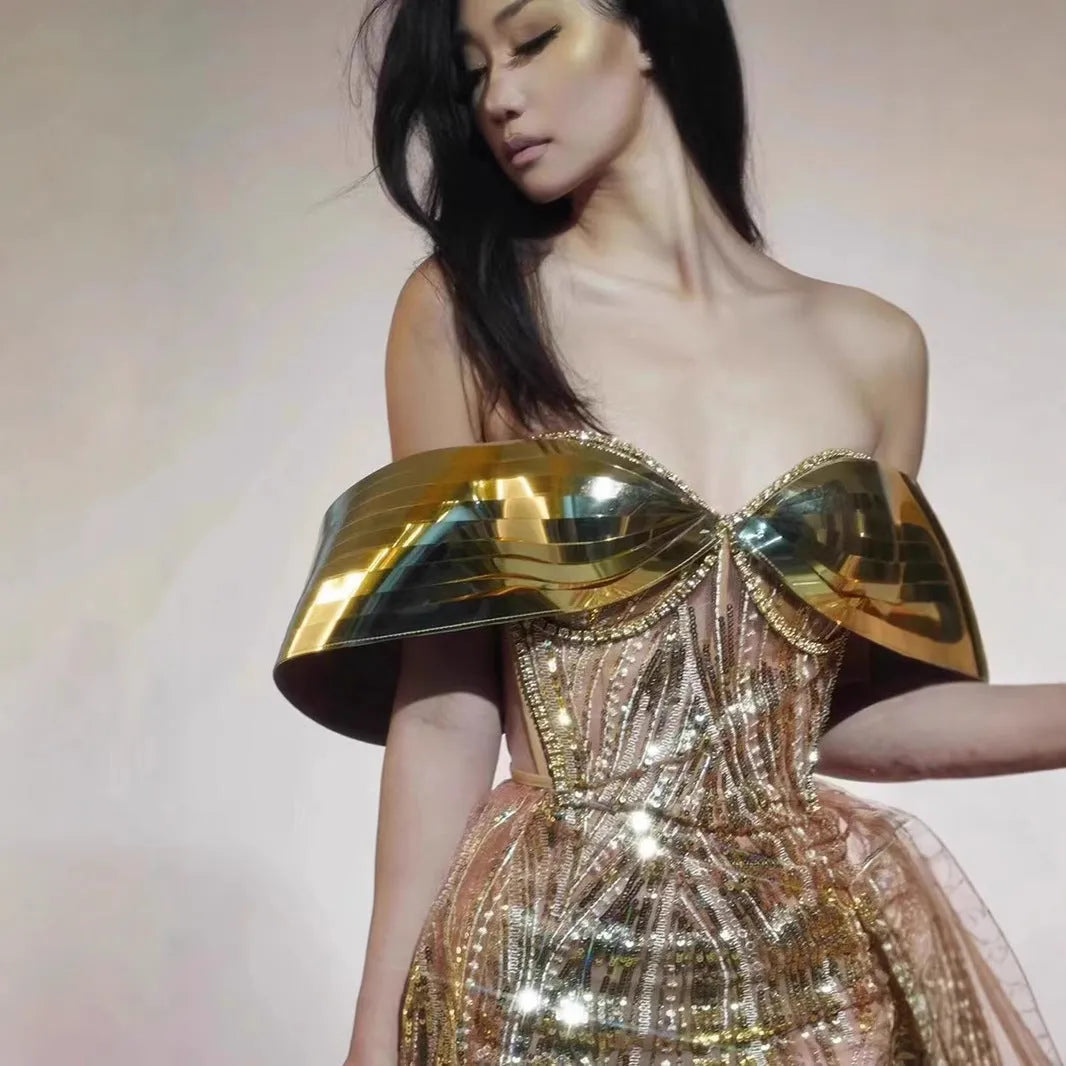 Gold strapless sequined dress with thigh-high split and tulle overlay, formal women's gown