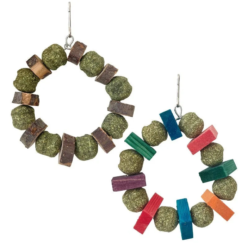 Hamster chew toy with applewood chewing surface and decorative straw ball ring
