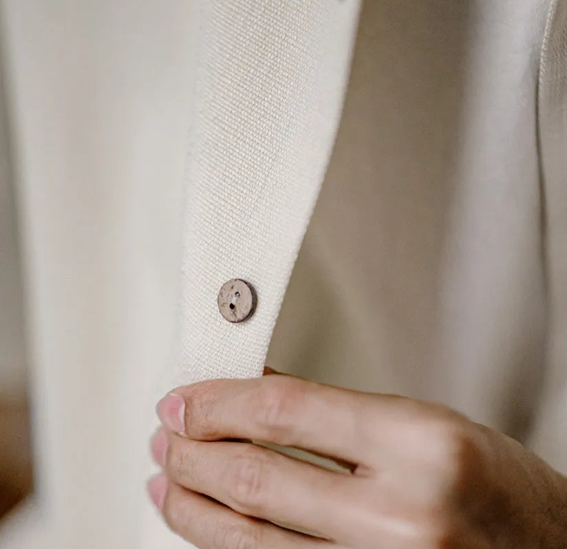 Light apricot men's shirt with bamboo floral pattern and Cuban collar on hanger