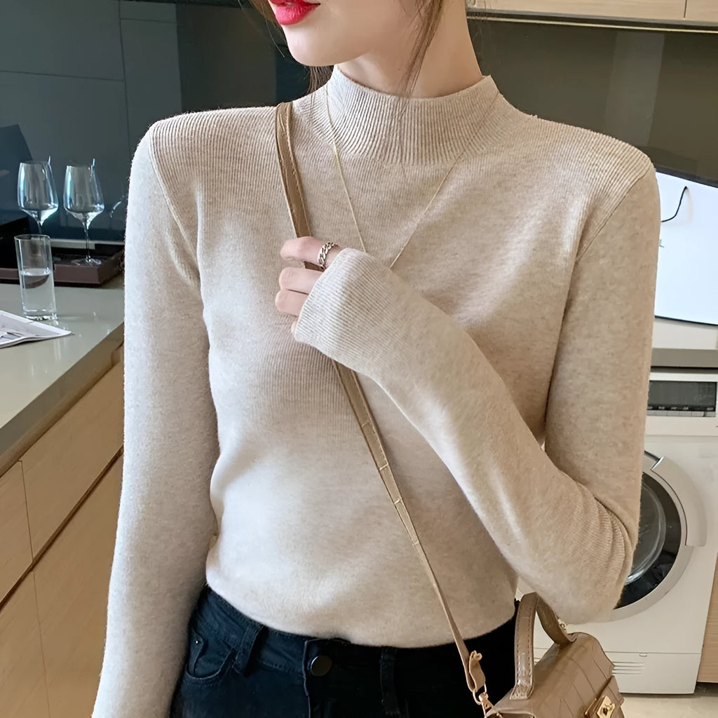 Viscose slim fit long sleeve pullover top in apricot colour on a hanger