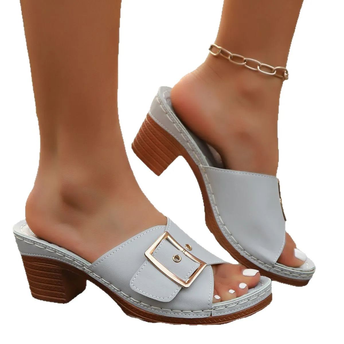 Women's black retro chunky heel slippers with a large metal buckle on the strap.