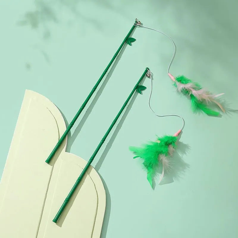 Green interactive cat feather wand toy with bells for play and training