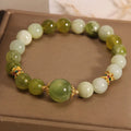 Women's bracelet made of green Xiuyan jade with an original Mori-inspired design.