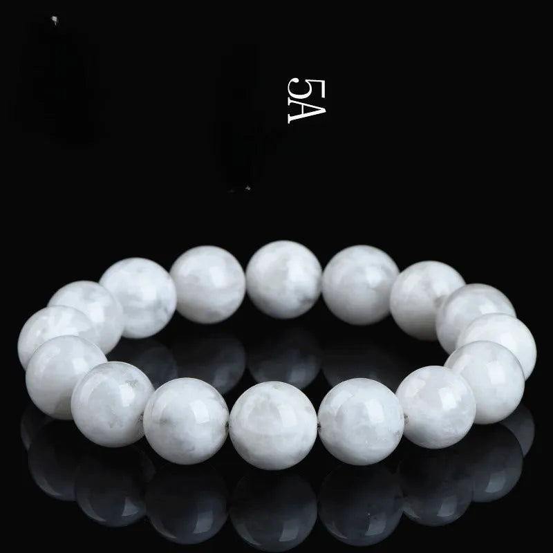 Close-up of a women's bracelet with round geometric crystal beads in a natural blizzard snowflake finish, showing Ruyi and Xiangyun design details.