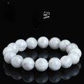Close-up of a women's bracelet with round geometric crystal beads in a natural blizzard snowflake finish, showing Ruyi and Xiangyun design details.