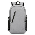 Oxford cloth casual backpack in blue, open to show interior, with a laptop inside.